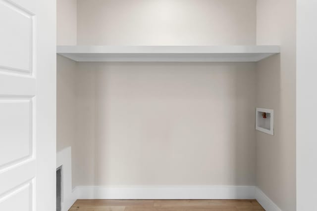 178 Charleston Ave, Pleasant View, TN 37146 - laundry area featuring hookup for a washing machine, light wood finished floors, and baseboards