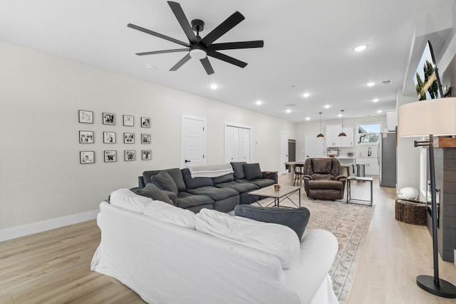 178 Charleston Ave, Pleasant View, TN 37146 - living room featuring light wood-style flooring, ceiling fan, recessed lighting, and baseboards