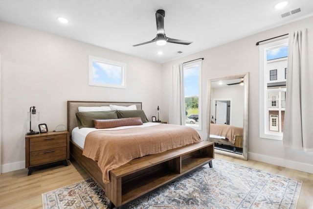 178 Charleston Ave, Pleasant View, TN 37146 - bedroom with multiple windows, light wood-style floors, baseboards, and recessed lighting