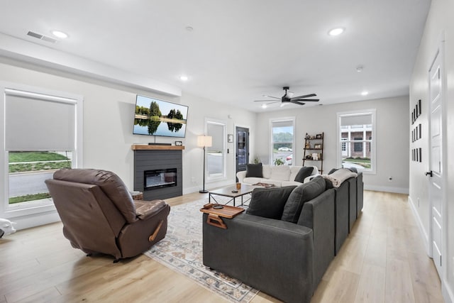 178 Charleston Ave, Pleasant View, TN 37146 - living area with a glass covered fireplace, light wood-type flooring, recessed lighting, ceiling fan, and baseboards