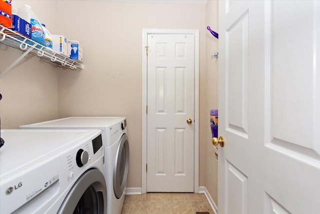 2129 Hollandale Cir, Columbia, TN 38401 - laundry room featuring independent washer and dryer, baseboards, and light tile patterned floors