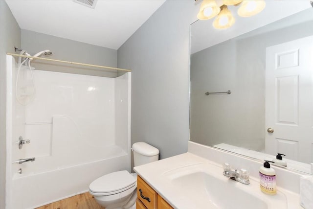 2129 Hollandale Cir, Columbia, TN 38401 - bathroom featuring vanity, toilet, shower / bathtub combination, and wood finished floors