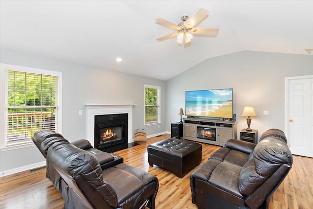 2129 Hollandale Cir, Columbia, TN 38401 - living room with a fireplace with flush hearth, vaulted ceiling, wood finished floors, ceiling fan, and baseboards