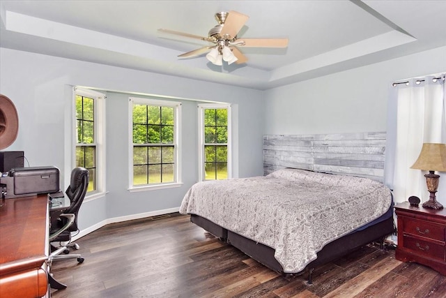 2129 Hollandale Cir, Columbia, TN 38401 - bedroom with a raised ceiling, wood finished floors, a desk, and multiple windows
