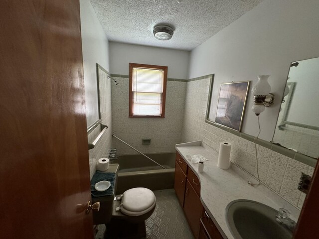 2168 Jefferson Rd, Smithville, TN 37166 - full bathroom with toilet, a tub, tile walls, a textured ceiling, and vanity