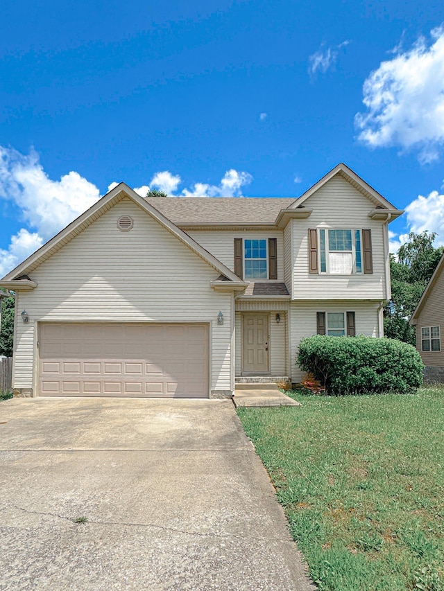 view of front facade with concrete driveway, a garage, a front yard, and a shingled roof
