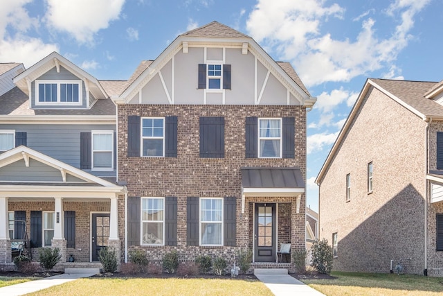 706 Hahn Ct, Lebanon, TN 37087 - view of front of house featuring brick siding, a front lawn, a porch, and roof with shingles