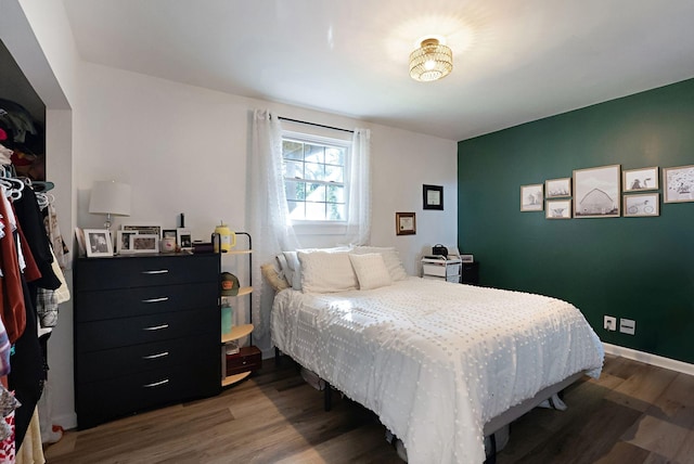 bedroom featuring wood finished floors