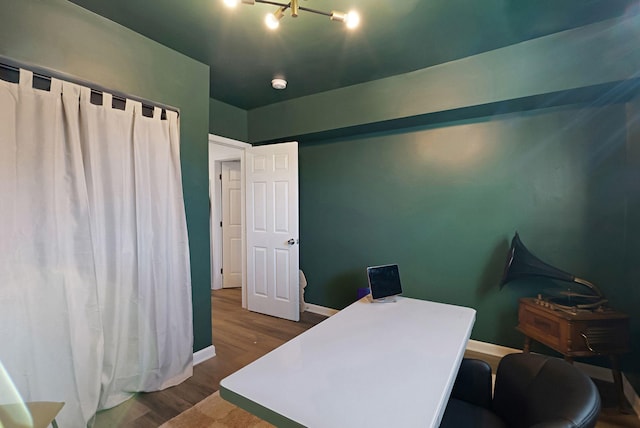 office with wood finished floors, baseboards, and a chandelier