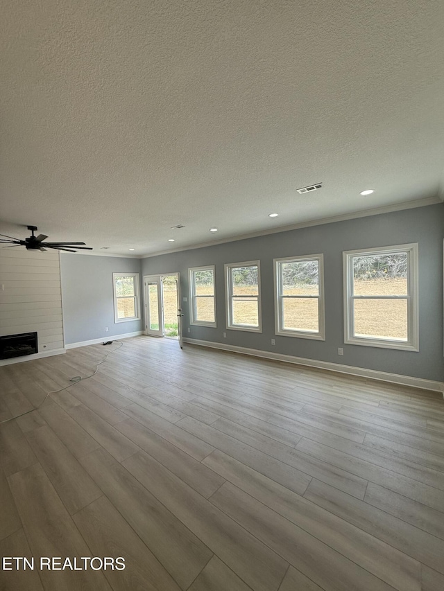 222 Ten Mile Ln, Ten Mile, TN 37880 - unfurnished living room featuring a textured ceiling, wood finished floors, baseboards, recessed lighting, and a ceiling fan