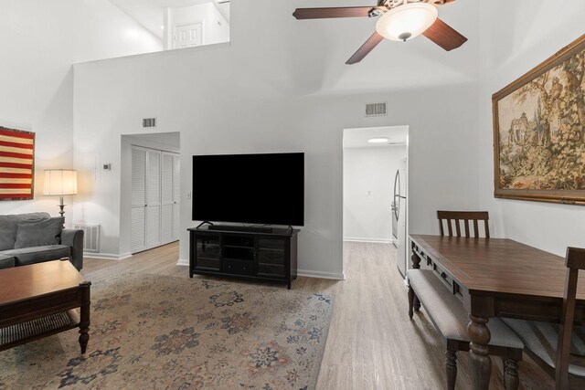 1129 W Main St Unit 21, Franklin, TN 37064 - living room with a high ceiling, wood finished floors, ceiling fan, and baseboards