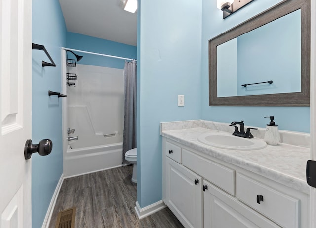 1129 W Main St Unit 21, Franklin, TN 37064 - full bath with wood finished floors, toilet, vanity, shower / bath combo with shower curtain, and baseboards