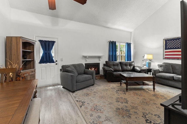 1129 W Main St Unit 21, Franklin, TN 37064 - living area featuring a ceiling fan, wood finished floors, lofted ceiling, and a brick fireplace