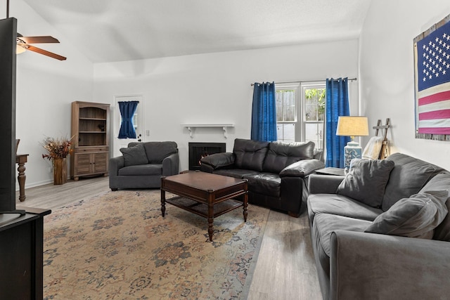 1129 W Main St Unit 21, Franklin, TN 37064 - living area with wood finished floors, ceiling fan, vaulted ceiling, and a warm lit fireplace