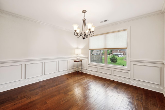 1403 Wade Hampton Ct, Lebanon, TN 37087 - empty room with a chandelier, crown molding, dark wood-type flooring, wainscoting, and a decorative wall