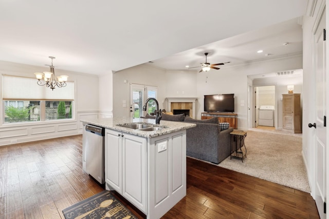 1403 Wade Hampton Ct, Lebanon, TN 37087 - kitchen with dishwasher, a sink, a fireplace, dark wood-style floors, and ornamental molding