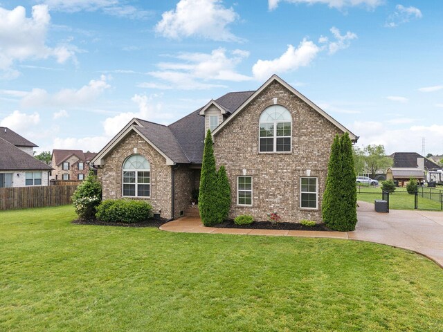 1403 Wade Hampton Ct, Lebanon, TN 37087 - traditional-style house featuring brick siding and a shingled roof
