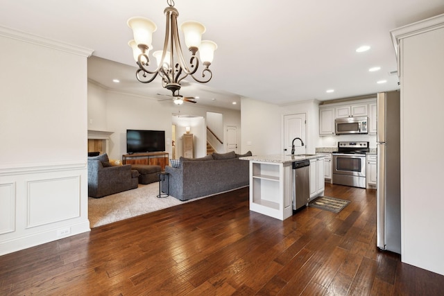 1403 Wade Hampton Ct, Lebanon, TN 37087 - kitchen with stainless steel appliances, open floor plan, a chandelier, open shelves, and recessed lighting