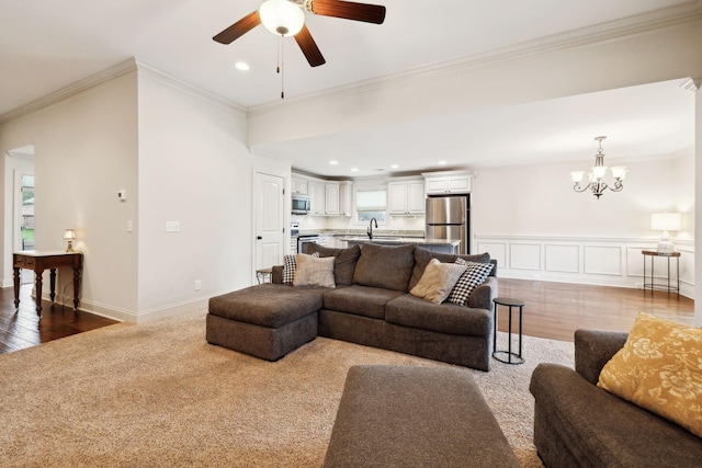 1403 Wade Hampton Ct, Lebanon, TN 37087 - living room with a ceiling fan, ornamental molding, a chandelier, wood finished floors, and recessed lighting