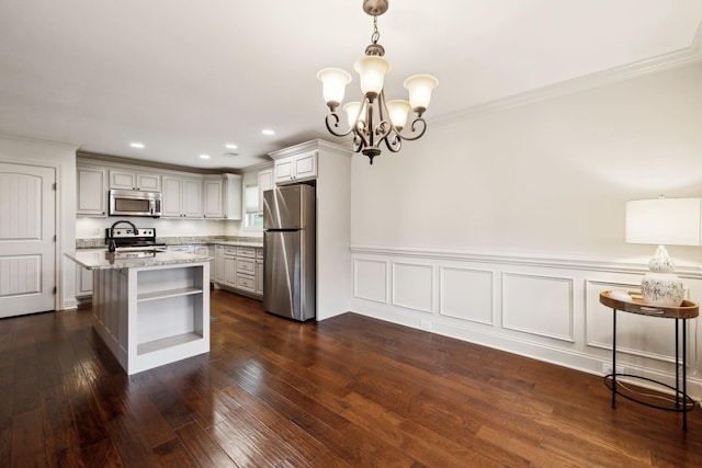 1403 Wade Hampton Ct, Lebanon, TN 37087 - kitchen featuring appliances with stainless steel finishes, open shelves, light stone countertops, a chandelier, and dark wood-type flooring