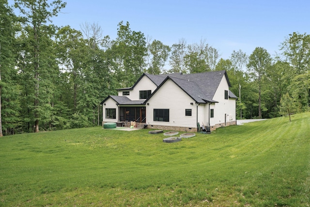 7361 Liberty Rd, Fairview, TN 37062 - back of property with a sunroom, crawl space, a yard, and roof with shingles