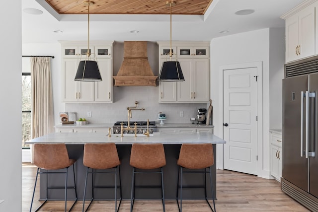 7361 Liberty Rd, Fairview, TN 37062 - kitchen featuring high end fridge, custom exhaust hood, a raised ceiling, backsplash, and wood ceiling