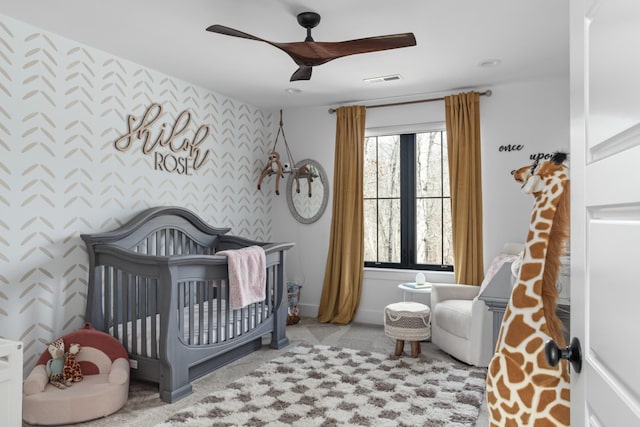 7361 Liberty Rd, Fairview, TN 37062 - bedroom featuring wallpapered walls, a ceiling fan, an accent wall, baseboards, and a nursery area