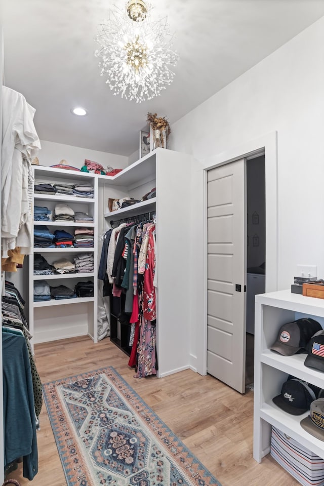 7361 Liberty Rd, Fairview, TN 37062 - spacious closet featuring light wood-style flooring and a chandelier