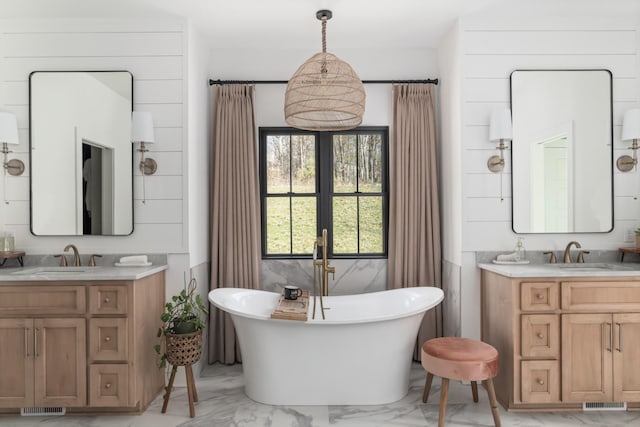 7361 Liberty Rd, Fairview, TN 37062 - full bathroom featuring marble finish flooring, a soaking tub, and two vanities