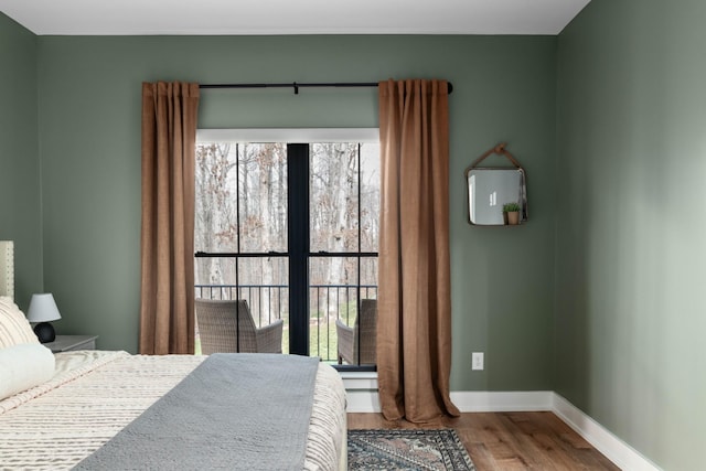 7361 Liberty Rd, Fairview, TN 37062 - bedroom featuring wood finished floors, multiple windows, and baseboards