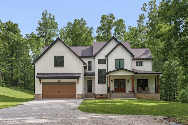 7361 Liberty Rd, Fairview, TN 37062 - modern farmhouse style home featuring driveway, a garage, a standing seam roof, roof with shingles, and a front yard