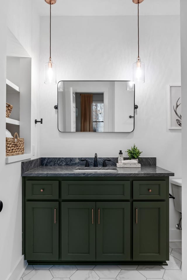 7361 Liberty Rd, Fairview, TN 37062 - bathroom with marble look tile flooring, vanity, baseboards, and toilet