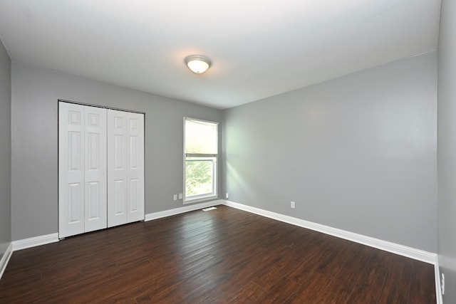 349 Marrell St, Gallatin, TN 37066 - unfurnished bedroom with baseboards, dark wood-style flooring, and a closet