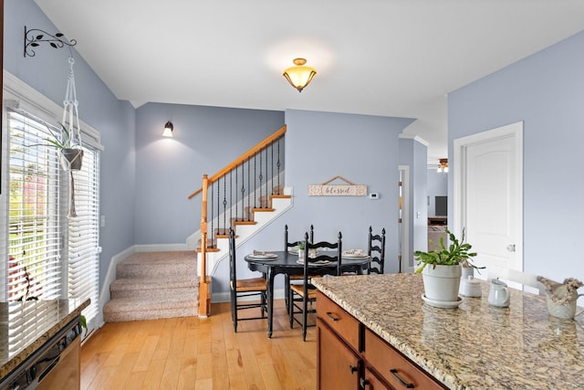 703 Asbury Hawn Dr, Lebanon, TN 37087 - interior space with plenty of natural light, light wood-style flooring, a ceiling fan, and brown cabinetry