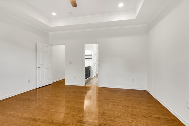 3015 Carpenters Pass, Spring Hill, TN 37174 - empty room with a tray ceiling, ornamental molding, wood finished floors, a ceiling fan, and baseboards