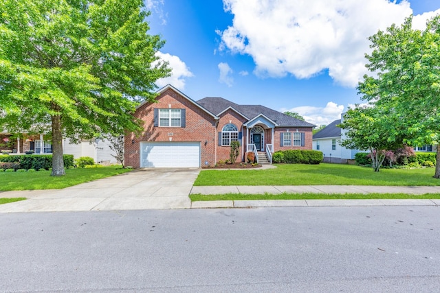 3015 Carpenters Pass, Spring Hill, TN 37174 - view of front of home featuring brick siding, an attached garage, concrete driveway, and a front yard