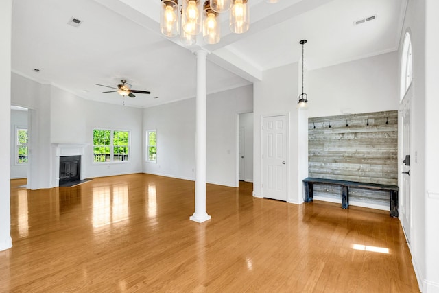 3015 Carpenters Pass, Spring Hill, TN 37174 - unfurnished living room with wood finished floors, a ceiling fan, decorative columns, baseboards, and a fireplace with flush hearth