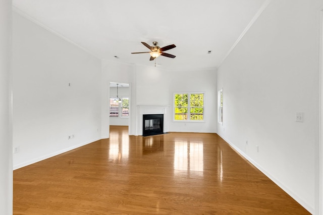3015 Carpenters Pass, Spring Hill, TN 37174 - unfurnished living room featuring ceiling fan, wood finished floors, baseboards, ornamental molding, and a fireplace with flush hearth