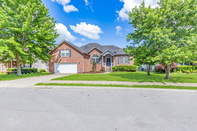 3015 Carpenters Pass, Spring Hill, TN 37174 - traditional-style house with brick siding, an attached garage, concrete driveway, and a front yard