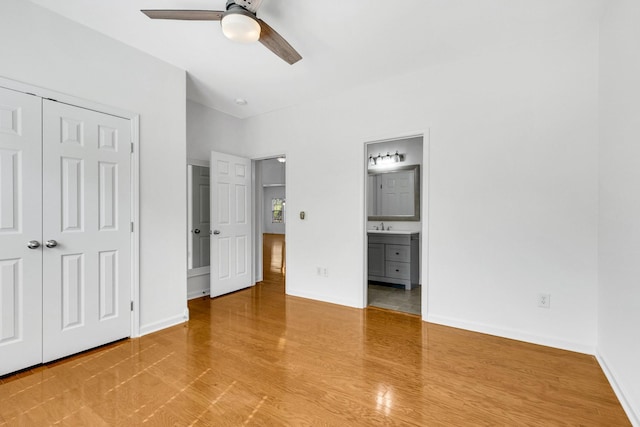 3015 Carpenters Pass, Spring Hill, TN 37174 - unfurnished bedroom with wood finished floors, connected bathroom, a closet, baseboards, and ceiling fan
