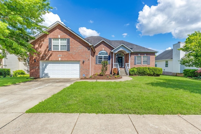 3015 Carpenters Pass, Spring Hill, TN 37174 - traditional home with an attached garage, brick siding, a front yard, and concrete driveway