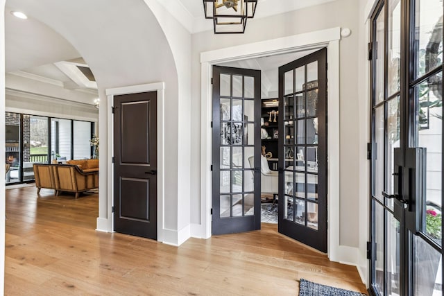5012 Toll Road Ct, Thompsons Station, TN 37179 - doorway with french doors, arched walkways, baseboards, wood finished floors, and crown molding