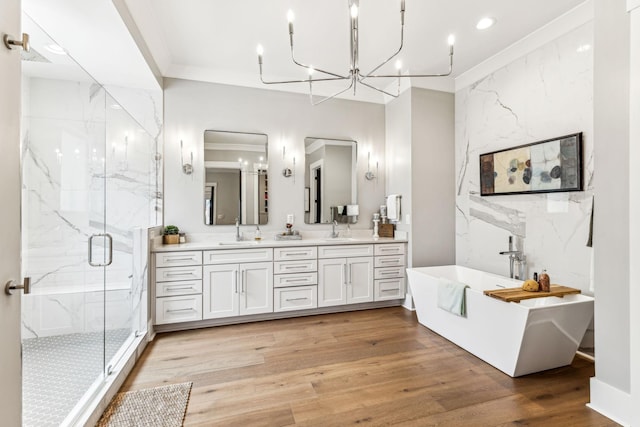 5012 Toll Road Ct, Thompsons Station, TN 37179 - bathroom with a marble finish shower, a soaking tub, wood finished floors, a chandelier, and double vanity