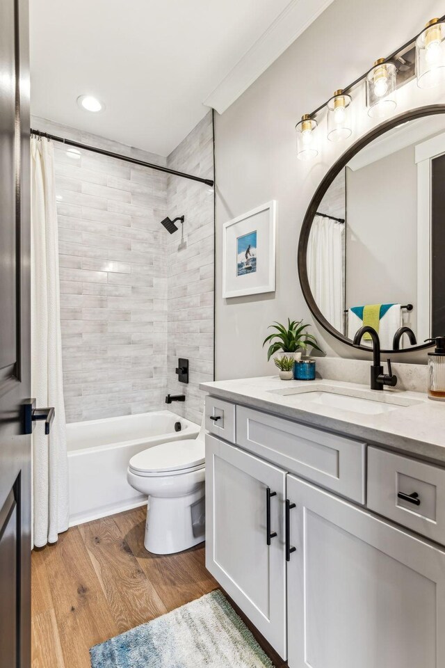 5012 Toll Road Ct, Thompsons Station, TN 37179 - full bath featuring vanity, toilet, wood finished floors, shower / tub combo, and recessed lighting
