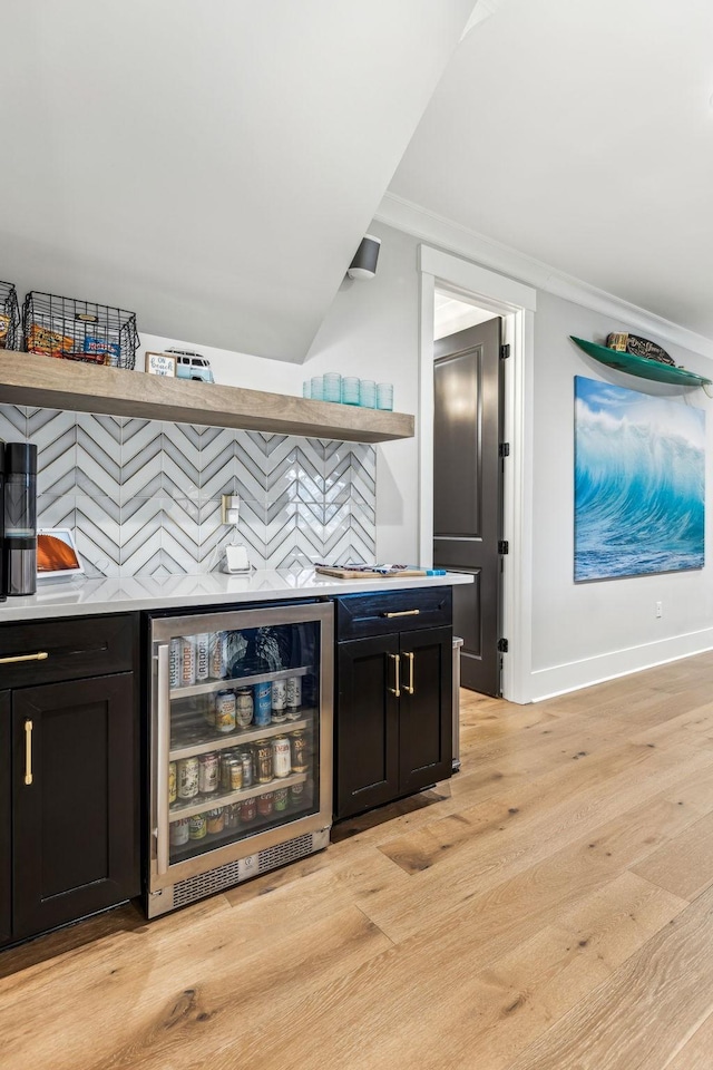 5012 Toll Road Ct, Thompsons Station, TN 37179 - indoor dry bar featuring beverage cooler, light wood-type flooring, baseboards, and ornamental molding