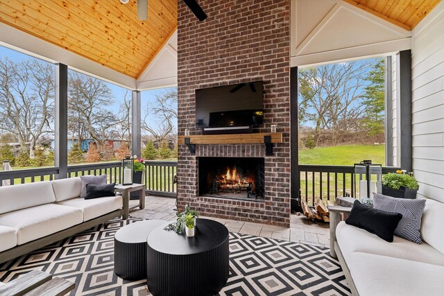 5012 Toll Road Ct, Thompsons Station, TN 37179 - sunroom / solarium with vaulted ceiling, an outdoor living space with a fireplace, and plenty of natural light