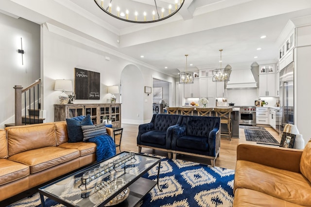 5012 Toll Road Ct, Thompsons Station, TN 37179 - living area with arched walkways, light wood finished floors, a chandelier, recessed lighting, and baseboards
