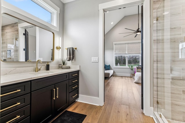 5012 Toll Road Ct, Thompsons Station, TN 37179 - ensuite bathroom with plenty of natural light, wood finished floors, vanity, baseboards, and lofted ceiling