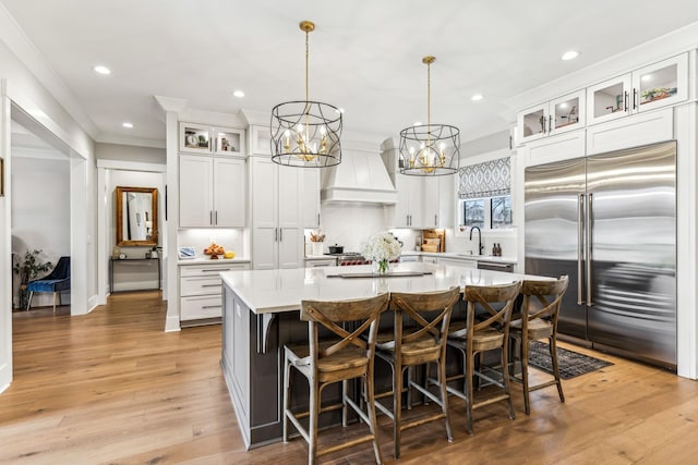 5012 Toll Road Ct, Thompsons Station, TN 37179 - kitchen featuring built in refrigerator, light countertops, a kitchen island, premium range hood, and recessed lighting