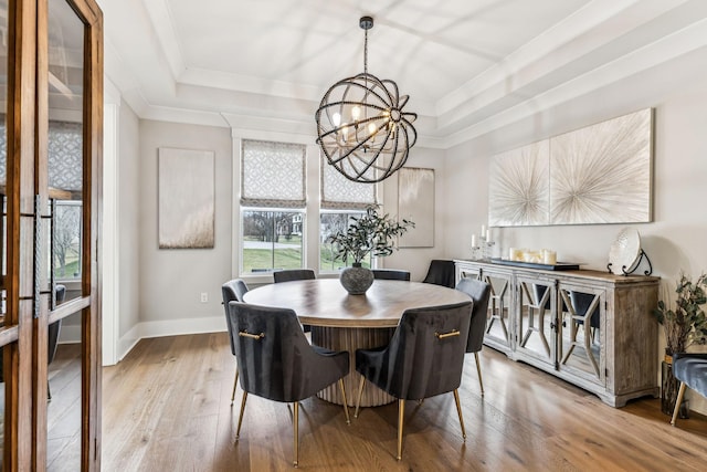 5012 Toll Road Ct, Thompsons Station, TN 37179 - dining area with a tray ceiling, a chandelier, hardwood / wood-style floors, baseboards, and ornamental molding